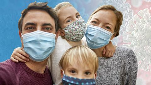 Man, woman and two kids wearing blue masks
